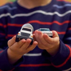 Child with toy cars